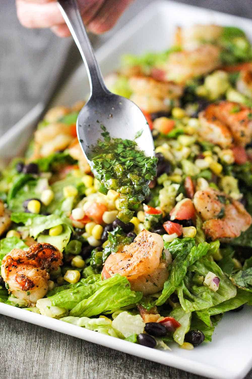 Use a spoon to drizzle the lime-cilantro dressing over the plated salad. 