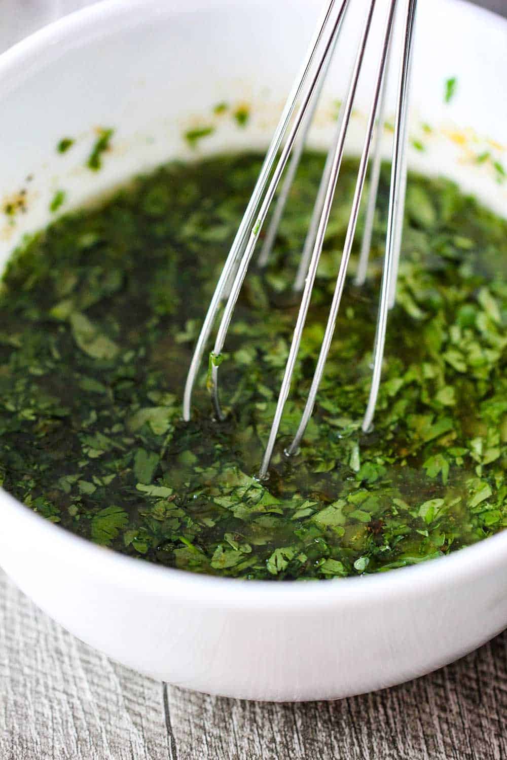 Use a whisk to make the marinade and the dressing for the grilled shrimp, corn and avocado salad. 