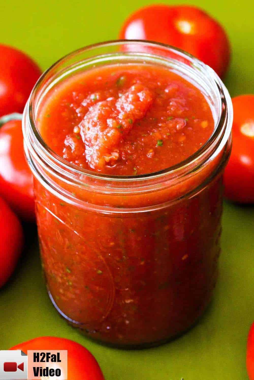 Restaurant-quality salsa in a jar on a green board