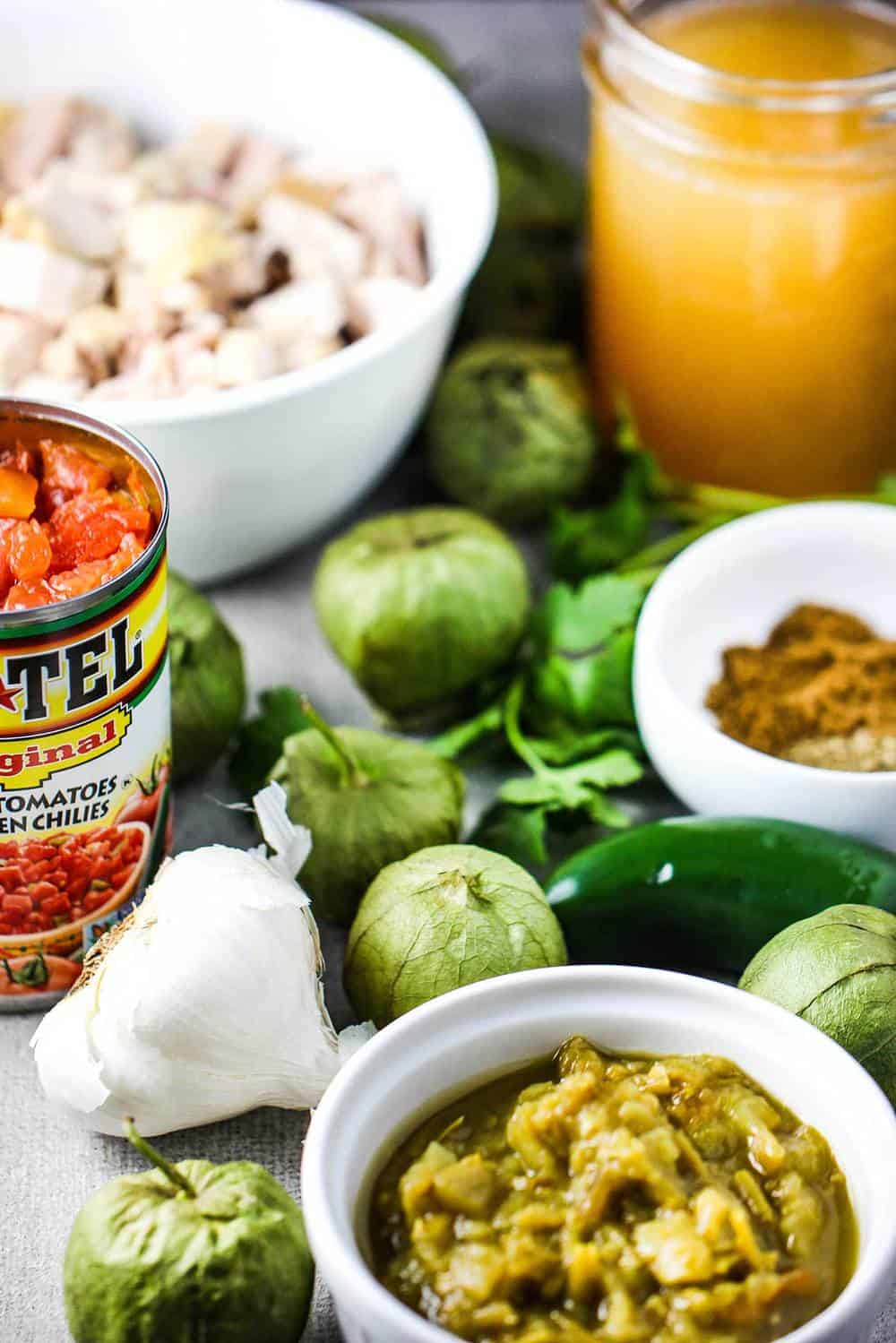 A tabletop of ingredient for White Chili with Tomatillos and Chicken