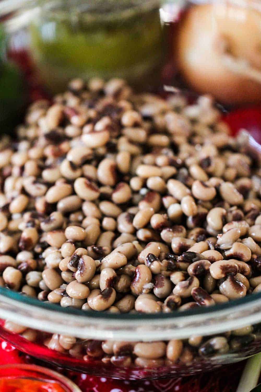 A large glass bowl filled with rinsed black-eyed peas. 