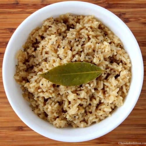 Amazing Cajun rice in a white bowl with a wood background