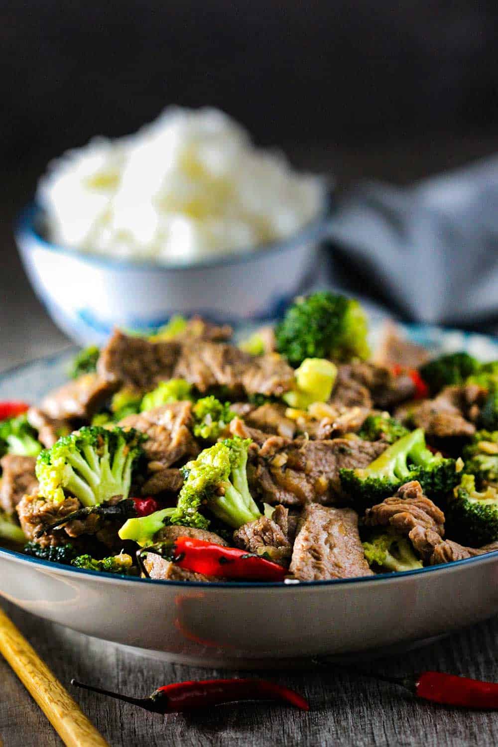 A bowl of beef and broccoli stir-fry with Jasmine rice. 