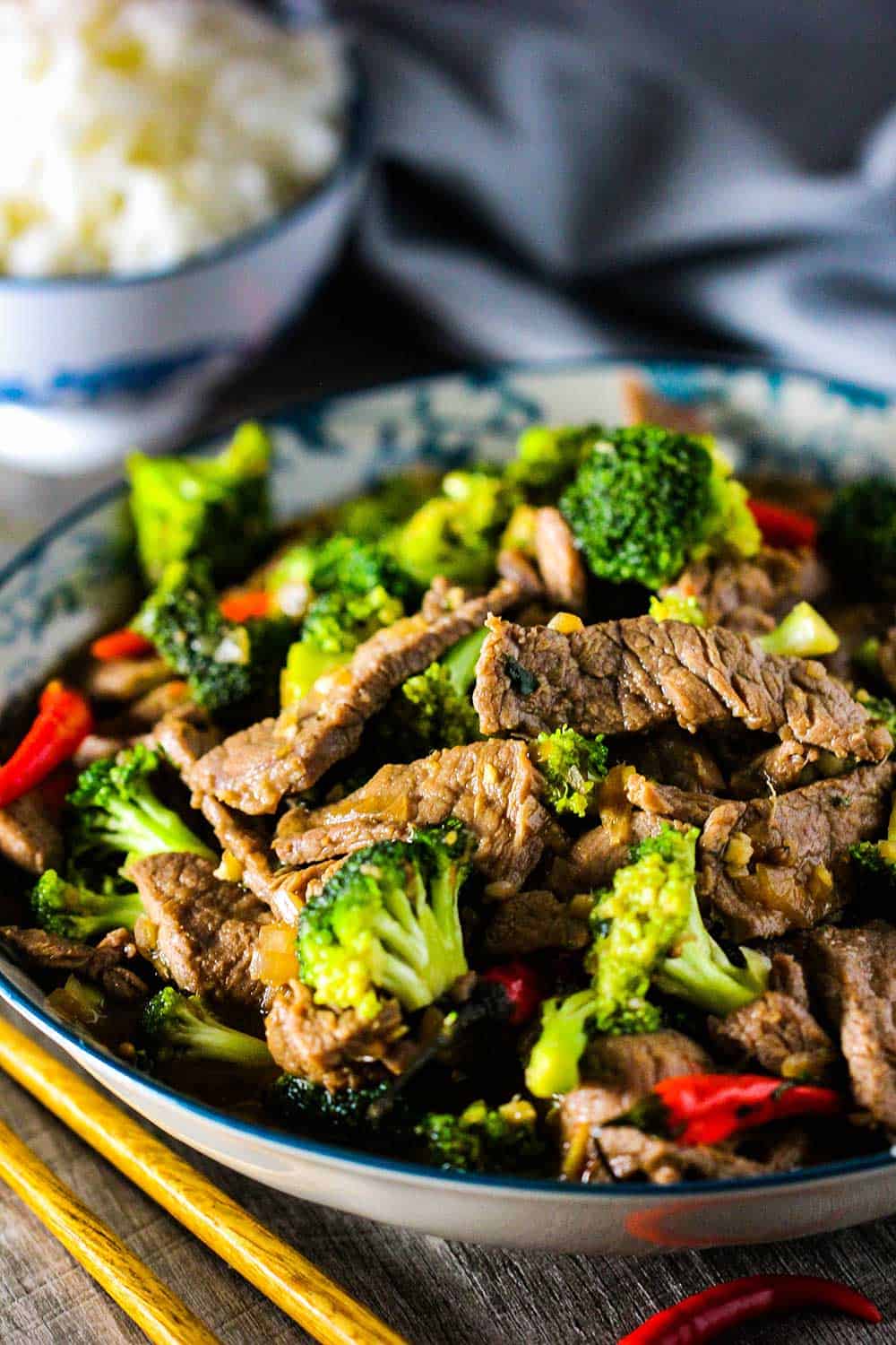 Cooked beef and broccoli stir-fry in a large serving dish. 