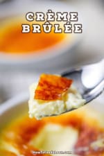 A raised spoon with a serving of crème brûlée on it.