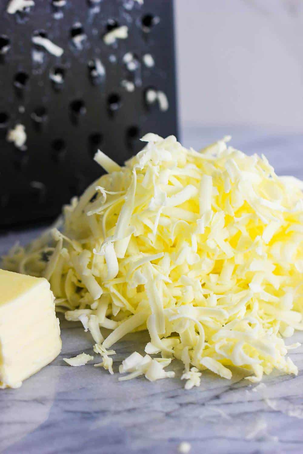 Grated butter next to a box grater