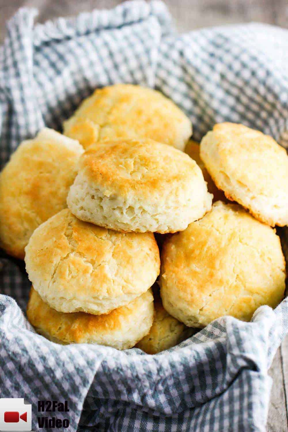 Homemade southern biscuits in a basket with a patterned napkin