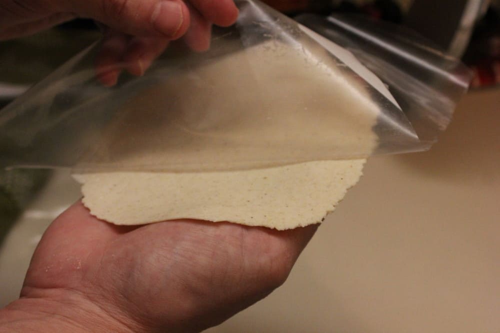 use cut freezer bag for each pressing