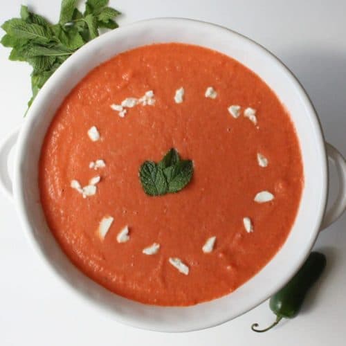 Watermelon Gazpacho with Jalapeno, Feta and Mint in a white bowl