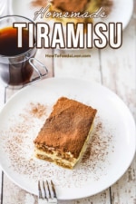 A dessert plate containing a slice of tiramisu sprinkled with cocoa powder and a glass mug of espresso next to it.