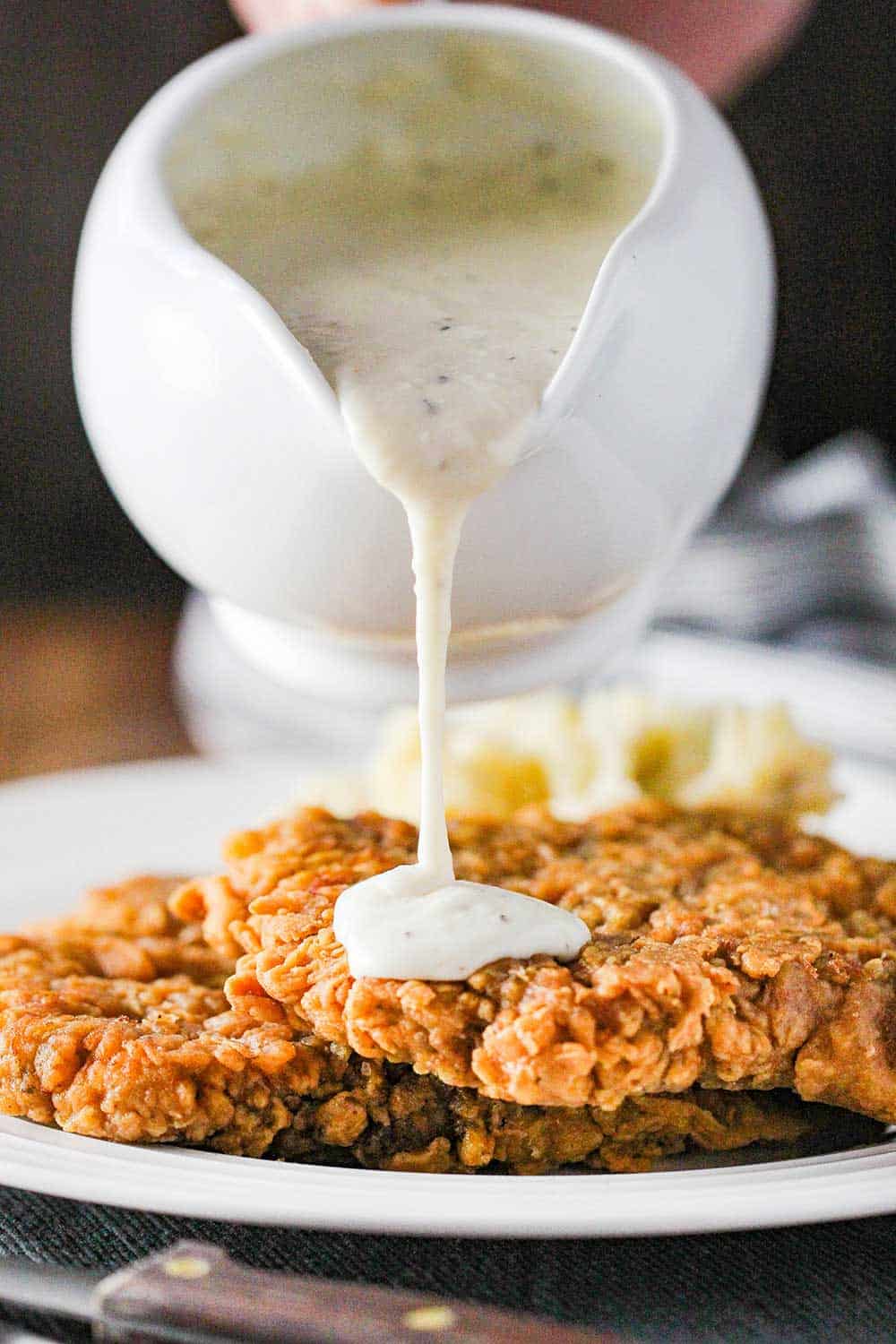 Pour cream gravy over the cooked chicken fried steak. 