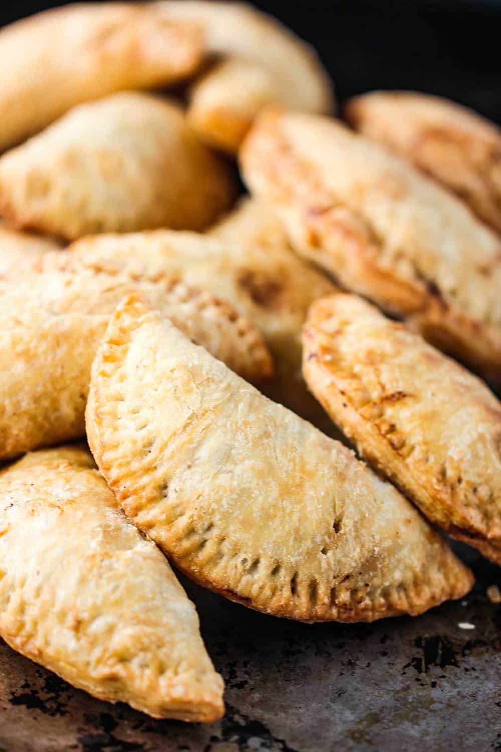 Fried classic meat pies on a baking sheet