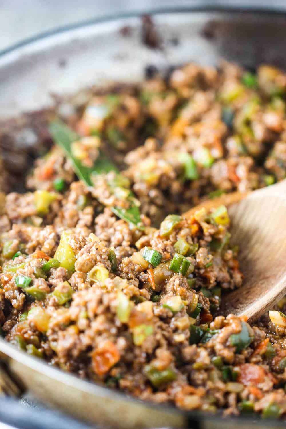 Savory beef filling in a skillet for classic meat pie recipe