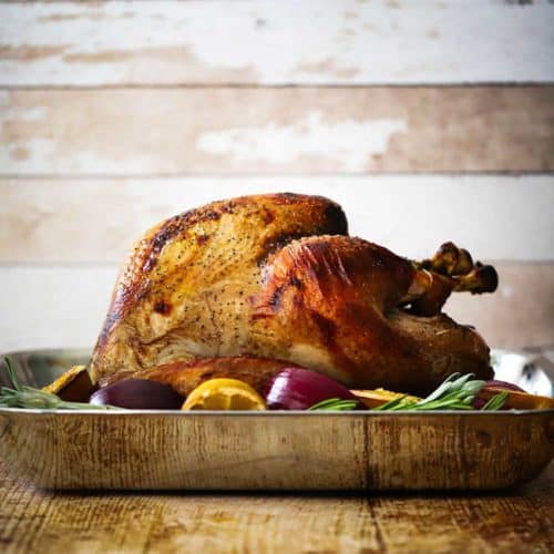 The perfect roasted turkey on a white platter