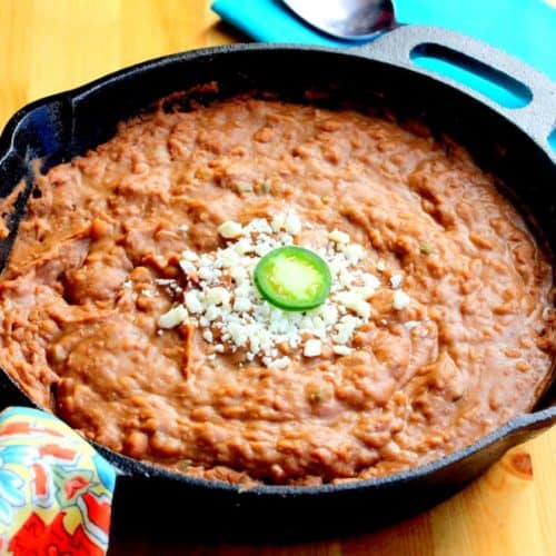 Easy gourmet refried beans in a large skillet