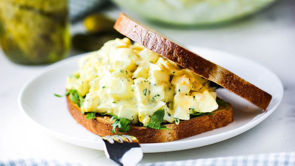 best-ever egg salad sandwich on a white plate