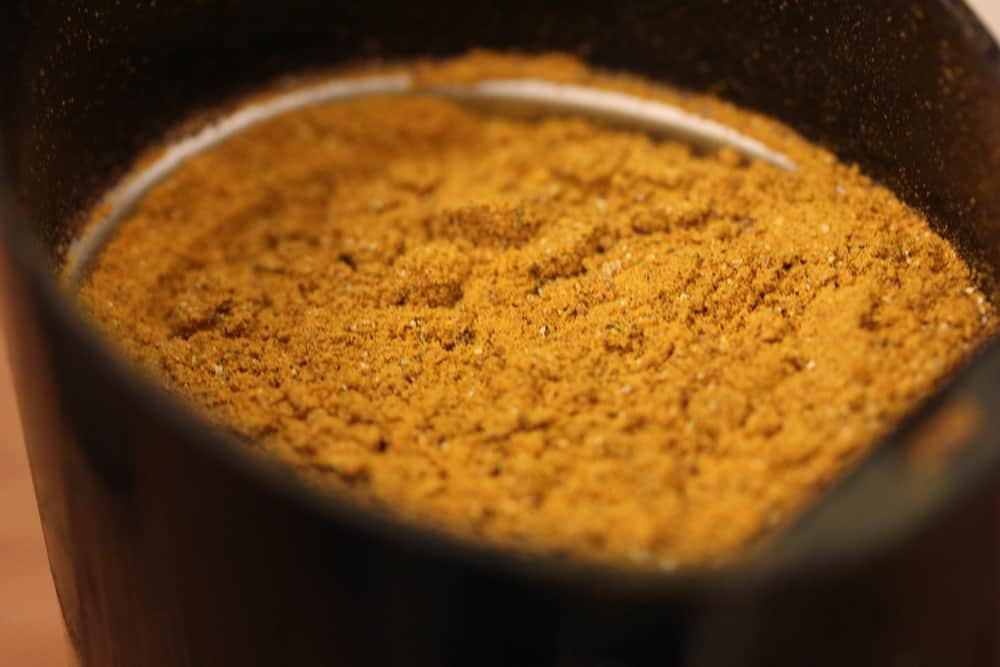 Homemade curry powder in a coffee grinder