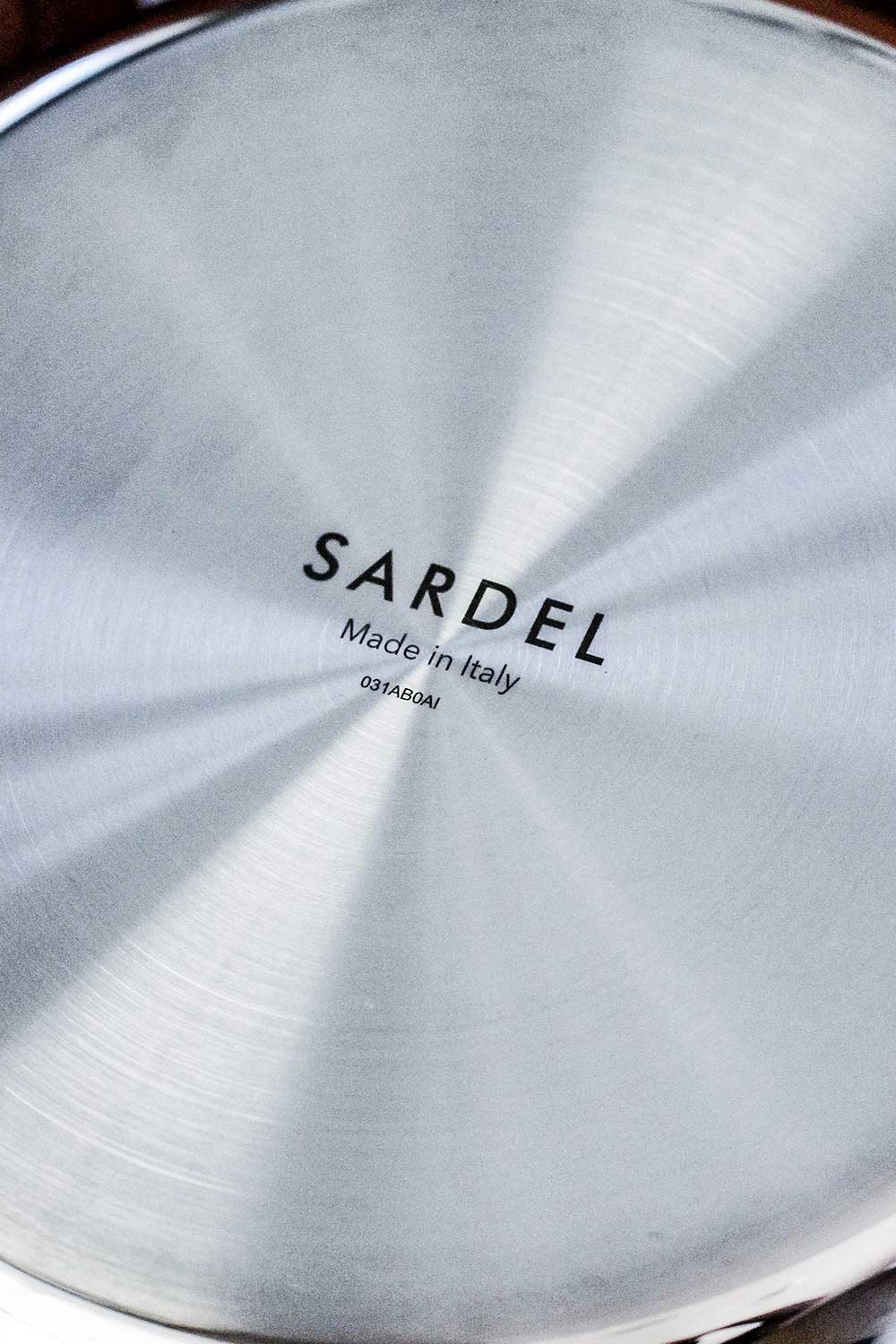 A Sardel saucepan turned upside down to see the logo on the bottom of the pan. 