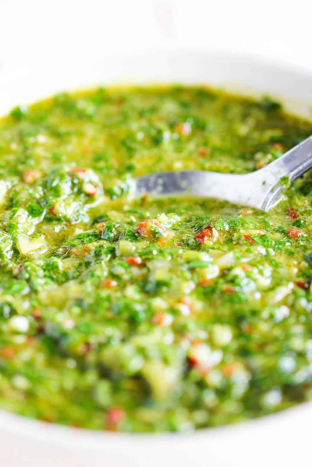 This chimichurri sauce is made with parsley, garlic, oregano, red wine vinegar and olive oil