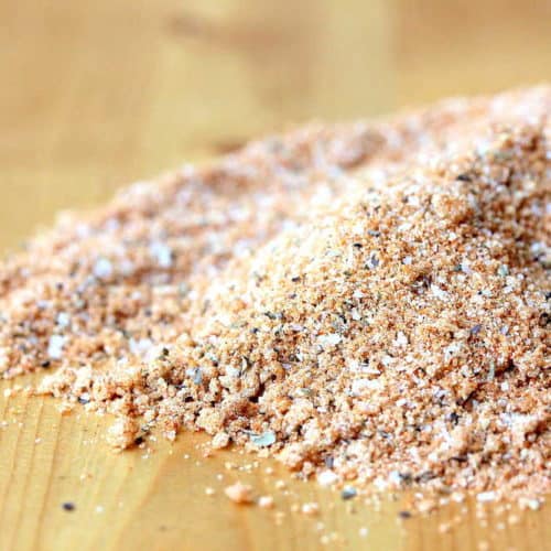 A small pile of a perfect BBQ rub sitting on a wooden cutting board.