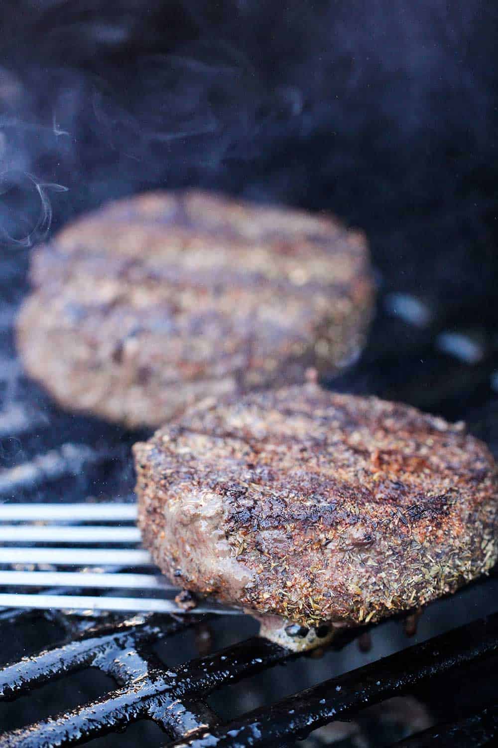 Black and bleu burgers on the grill. 