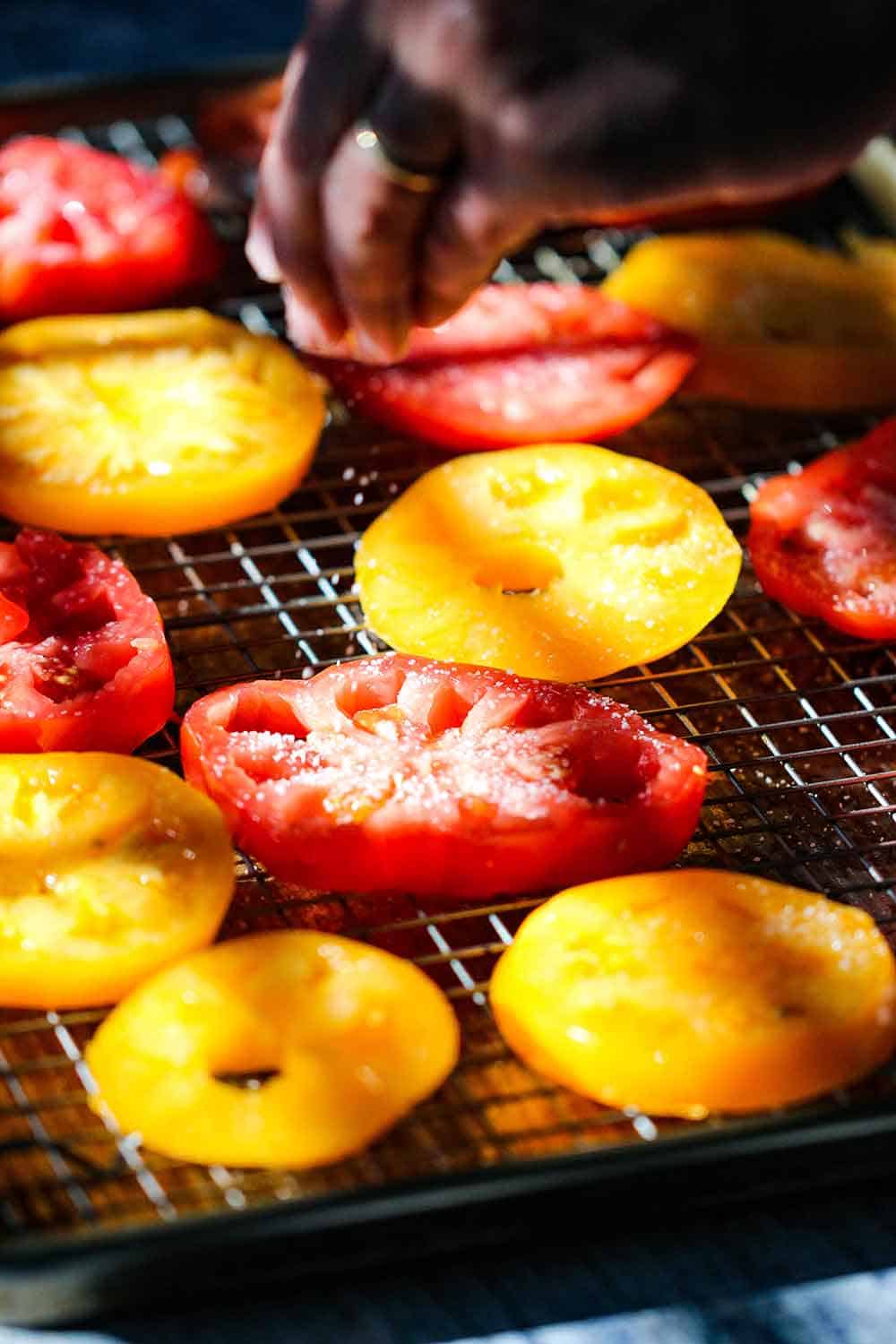 Sprinkle salt on the tomatoes to remove excess water. 