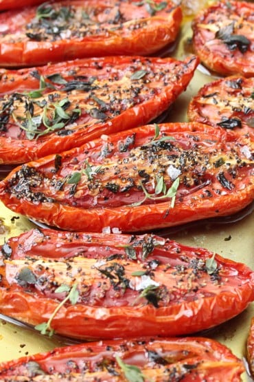 A baking sheet filled with slow-roasted tomatoes.