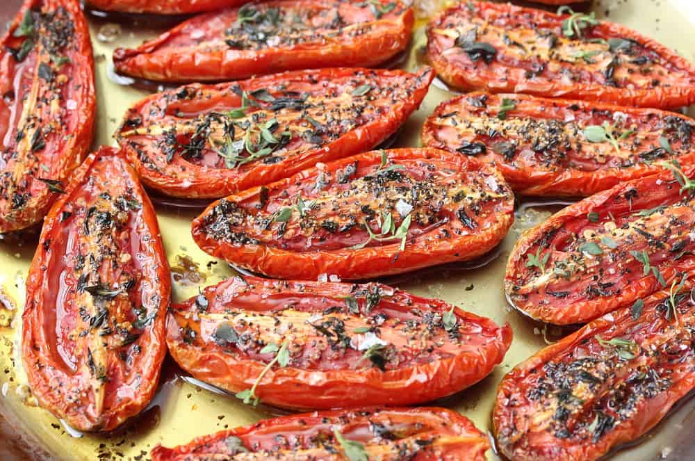 A baking sheet filled with slow-roasted tomatoes. 