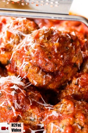 Italian meatballs with Parmesan cheese grated on top.
