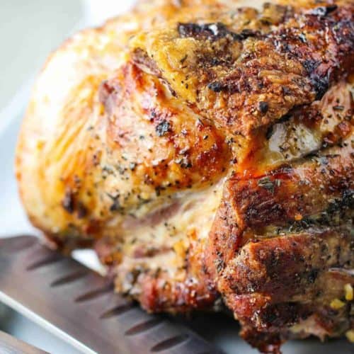 Slow Roasted Pork Shoulder on a platter with knife and fork