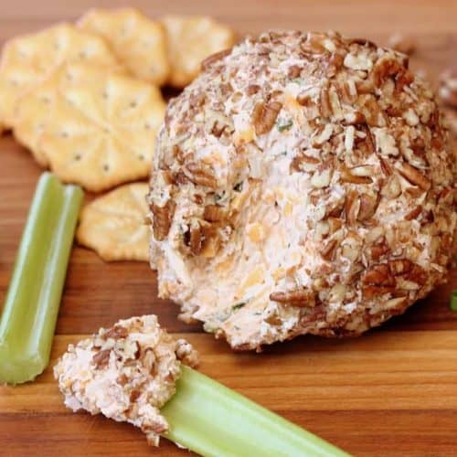 Classic Cheese Ball next to celery sticks and crackers