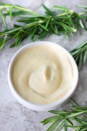 Rosemarie and Garlic Aioli in a small white bowl