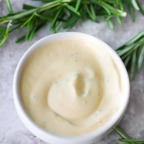 Rosemarie and Garlic Aioli in a small white bowl