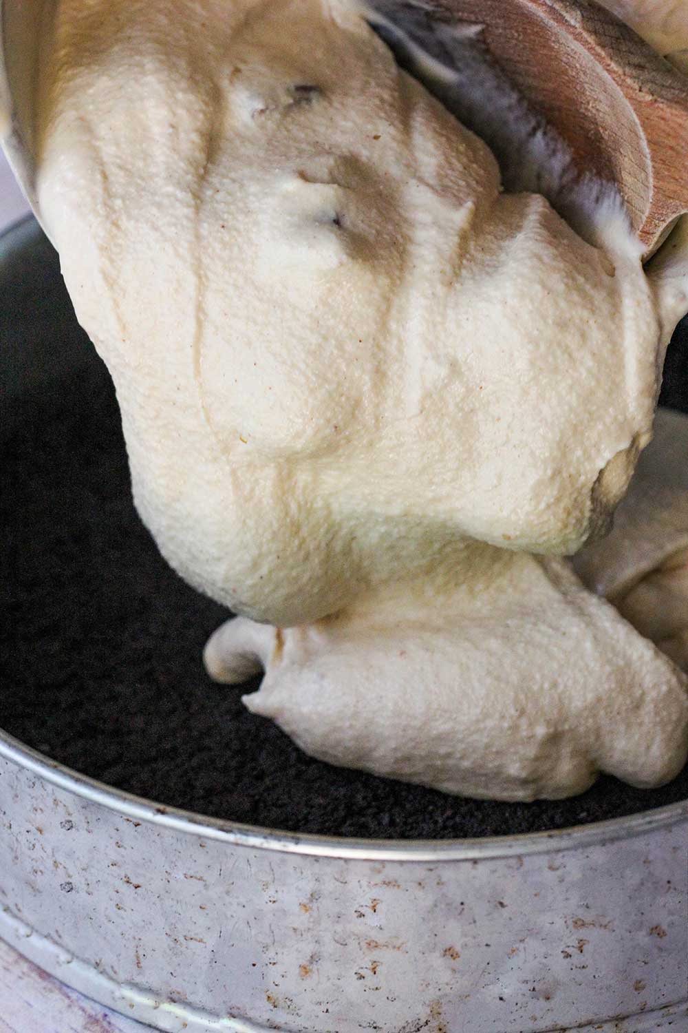 Pour the churned ice cream into a 9-inch springform pan with an Oreo crust. 