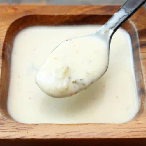 Alabama white sauce in a wooden bowl.