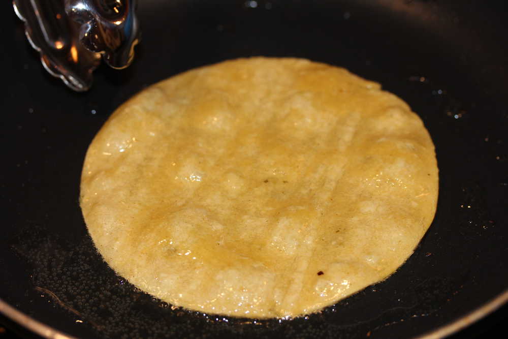 Lightly fry a corn tortilla in a little oil