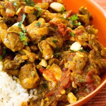 Authentic chicken curry in an orange bowl