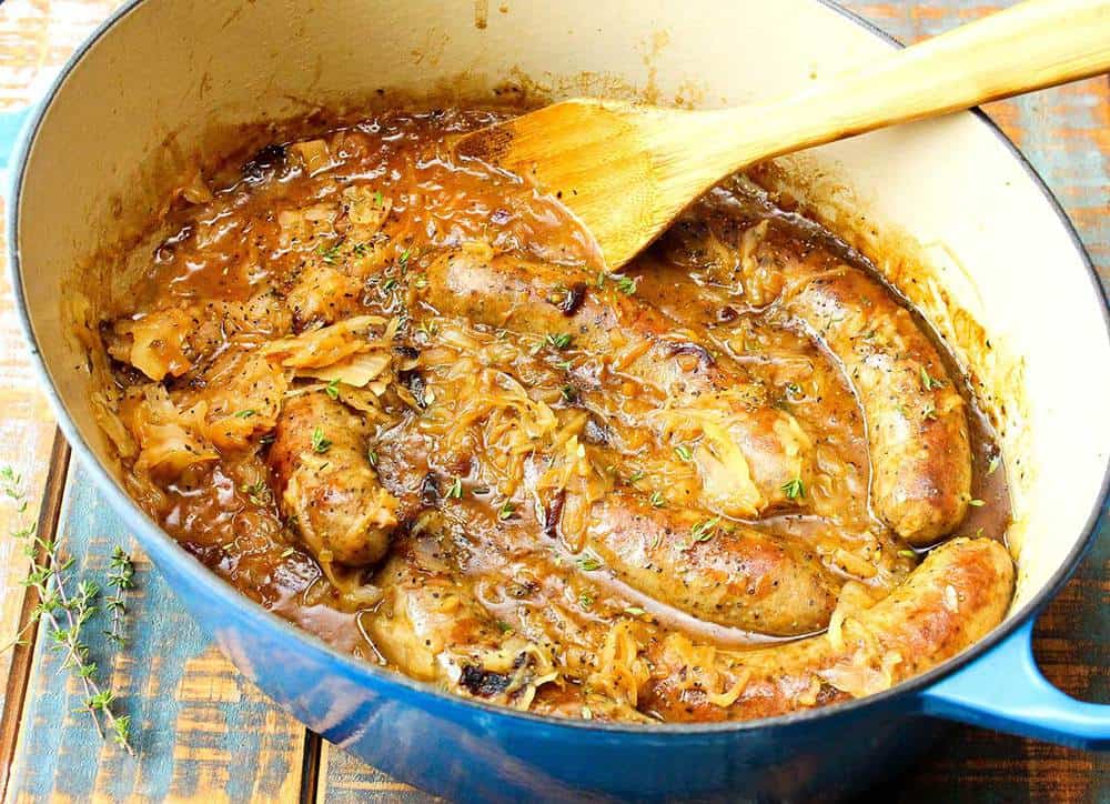 ale-braised bratwurst and sauerkraut in a Dutch oven