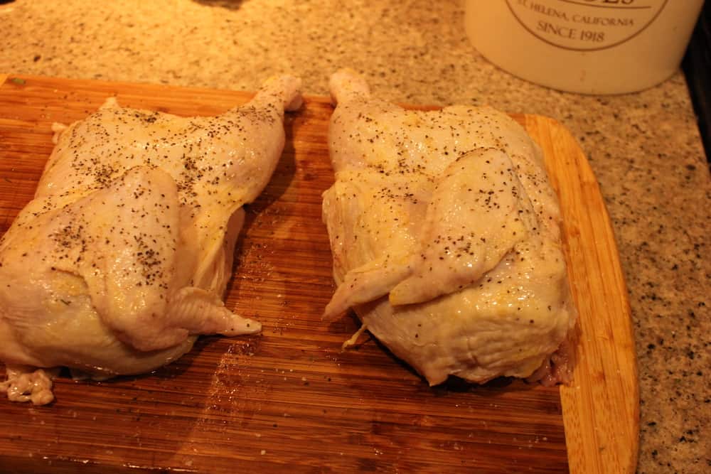Ask your butcher to cut the whole chicken in half for you