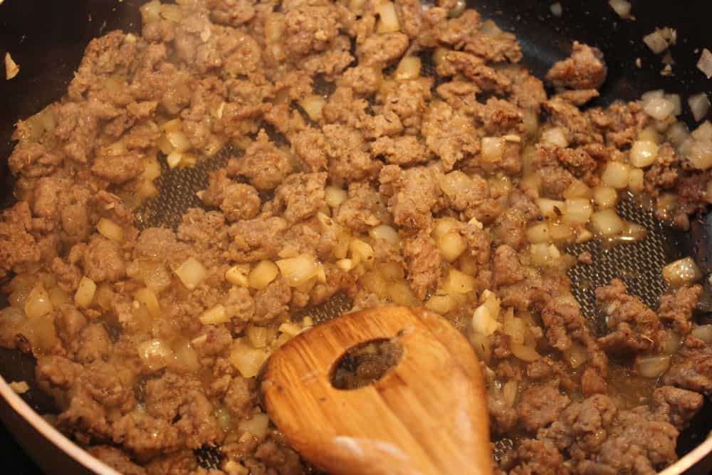 Spicy Italian sausage with onions and garlic in the skillet