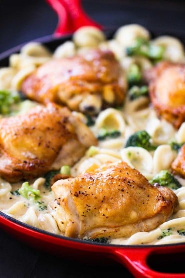 Creamy Pasta with Chicken and Broccoli in a red pan