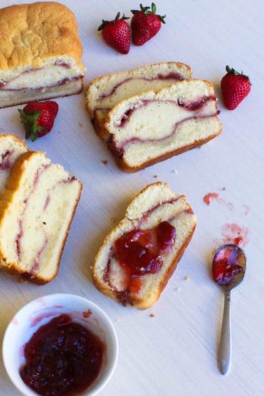 Strawberry Cream Cheese Pound Cake slices topped with strawberry sauce