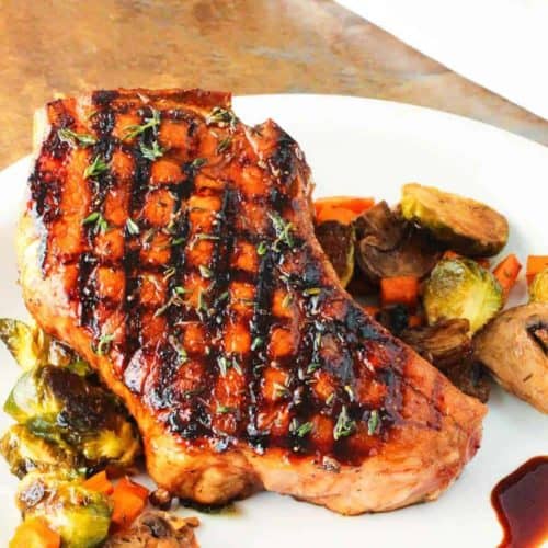 Balsamic Grilled Pork Chops on a white plate