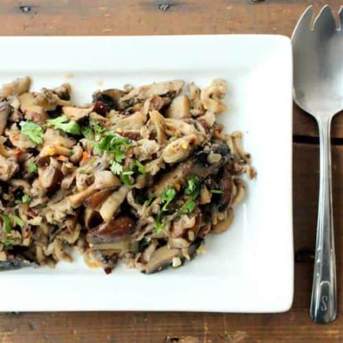 Wild Mushrooms with Shallots and Garlic on a white plate