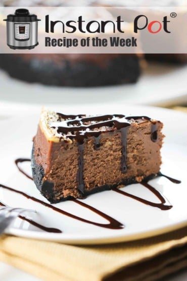 A slice of Instant Pot Chocolate Marble Cheesecake on a white plate