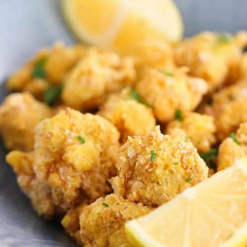 Fried Cauliflower with lemon slices in a blue bowl