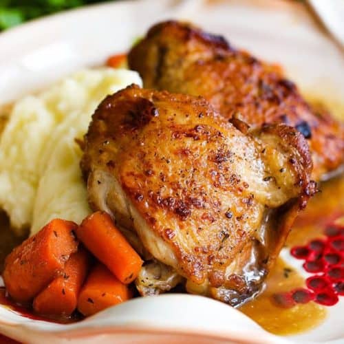 A white plate of Instant Pot honey balsamic chicken with carrots