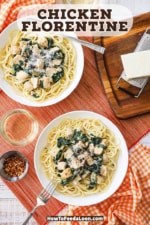 An overhead view of two pasta bowls filled with creamy chicken florentine both sitting on a bed of cooked pasta.