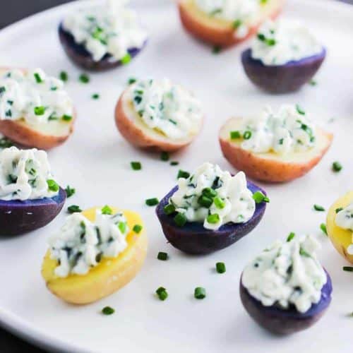 Stuffed New Potatoes with Cheese and Herbs on a white plate