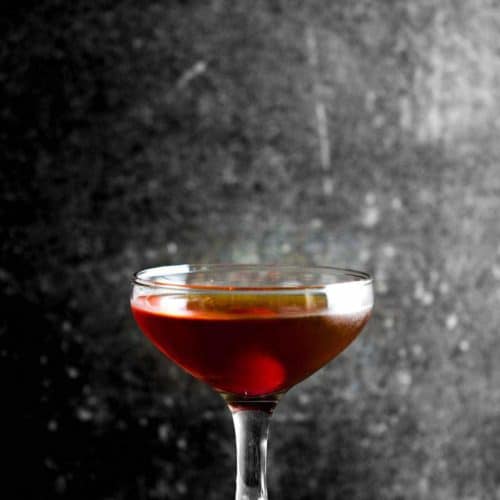 A glass filled with a Classic Manhattan Cocktail